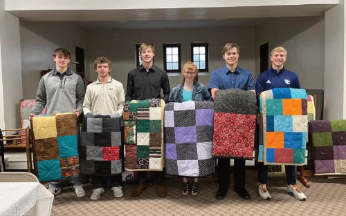 Seniors with quilts